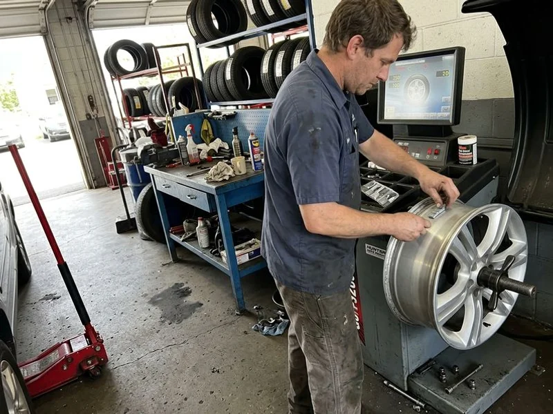Balance weights being applied on our computerized balancer