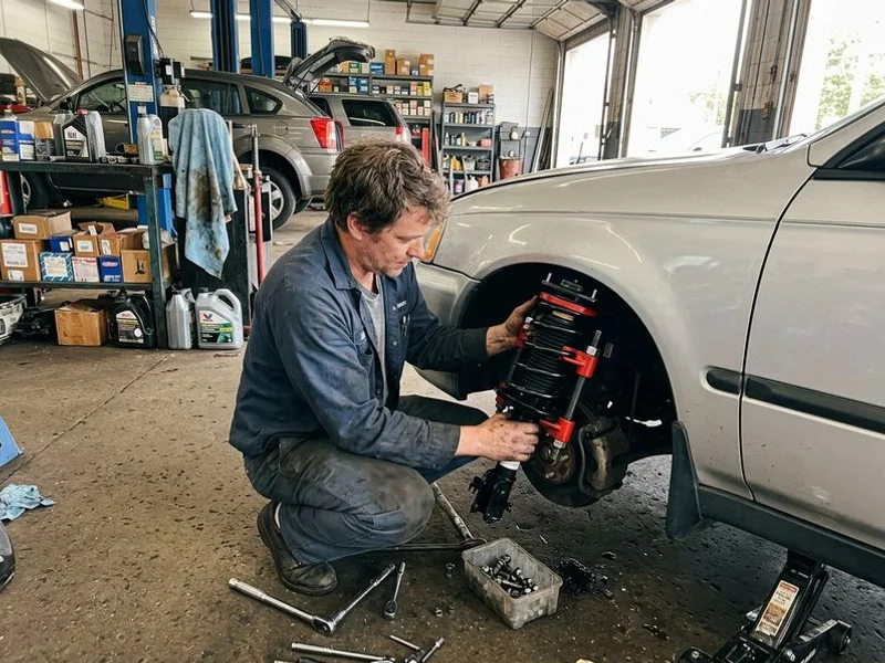 New MacPherson strut assembly being installed