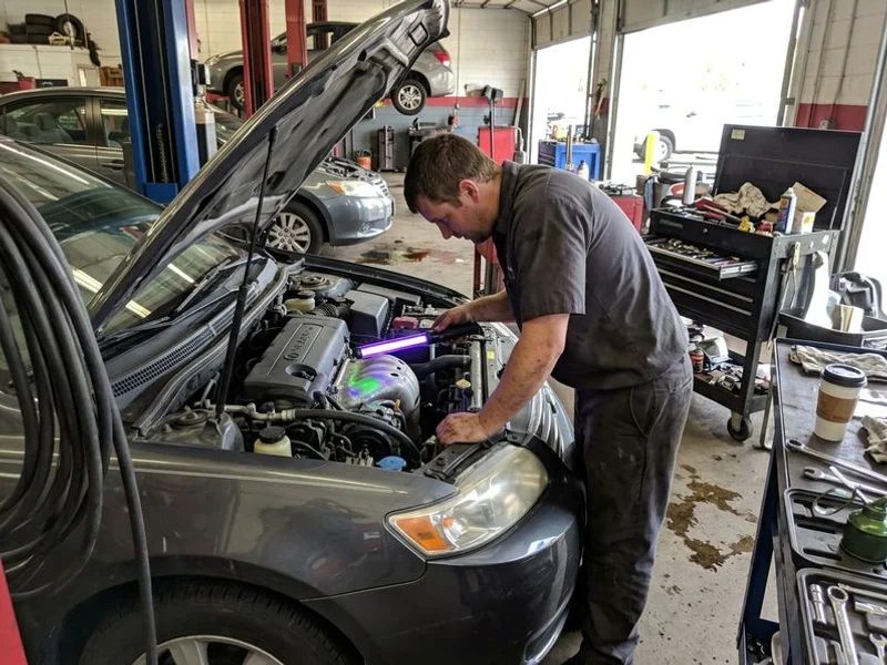 UV dye leak detection being performed on A/C system