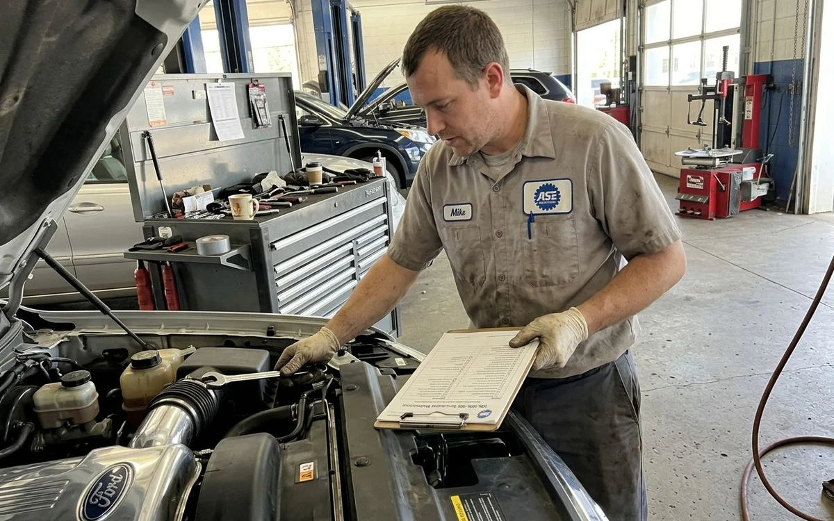 ASE-certified technician performing scheduled 30k/60k/90k mile service